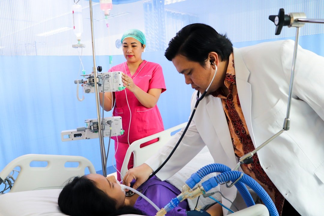 Clinician assessing a critically ill patient